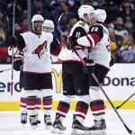 Arizona Coyotes center Martin Hanzal, center, of the Czech Republic, celebrates his goal with defenseman Oliver Ekman-Larsson, right, of Sweden, and left wing Anthony Duclair during the second period of an NHL hockey game against the Los Angeles Kings, Tuesday, Nov. 10, 2015, in Los Angeles. (AP Photo/Mark J. Terrill)