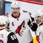 Arizona Coyotes' Shane Doan (19) celebrates with teammates Antoine Vermette (50) and Tobias Rieder after scoring against the Montreal Canadiens during the first period of an NHL hockey game in Montreal, Thursday, Nov. 19, 2015. (Graham Hughes/The Canadian Press via AP) MANDATORY CREDIT
