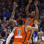 Oklahoma City Thunder forward Kevin Durant (35) passes to teammate Russell Westbrook (0) in the second quarter of an NBA basketball game against the Phoenix Suns in Oklahoma City, Sunday, Nov. 8, 2015. (AP Photo/Sue Ogrocki)
