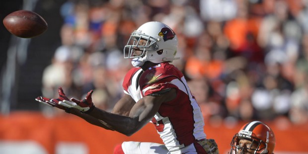 Arizona Cardinals wide receiver Jaron Brown (13) catches the ball for a first down as Cleveland Bro...
