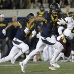 California wide receiver Bryce Treggs (1) runs on a touchdown reception during the first half of an NCAA college football game against Arizona State in Berkeley, Calif., Saturday, Nov. 28, 2015. (AP Photo/Jeff Chiu)