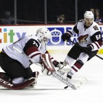 Arizona Coyotes goalie Anders Lindback (29) stops a shot on the goal  as teammate Antoine Vermette (50) watches during the second period of an NHL hockey game against the New York Islanders Monday, Nov. 16, 2015, in New York. (AP Photo/Frank Franklin II)