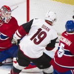 Arizona Coyotes' Shane Doan (19) scores on Montreal Canadiens goaltender Mike Condon as Canadiens' Tomas Fleischmann defends during the first period of an NHL hockey game in Montreal, Thursday, Nov. 19, 2015. (Graham Hughes/The Canadian Press via AP) MANDATORY CREDIT