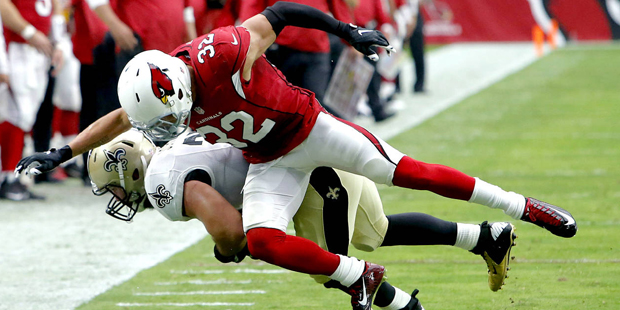 New Orleans Saints fullback Austin Johnson (35) is knocked out of bounds by Arizona Cardinals free ...