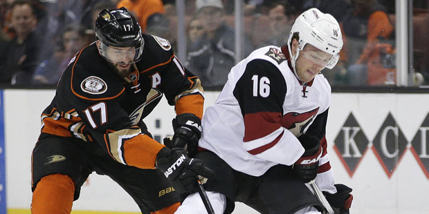 Arizona Coyotes' Max Domi, right, is defended by Anaheim Ducks' Ryan Kesler during the first period...