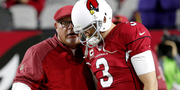 FILE - In this Dec. 10, 2015, file photo, Arizona Cardinals quarterback Carson Palmer and coach Bru...