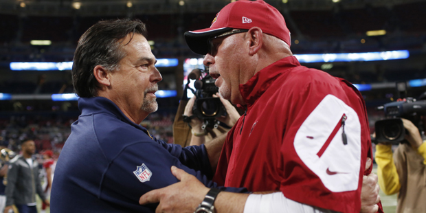 St. Louis Rams head coach Jeff Fisher talk with Arizona Cardinals head coach Bruce Arians following...