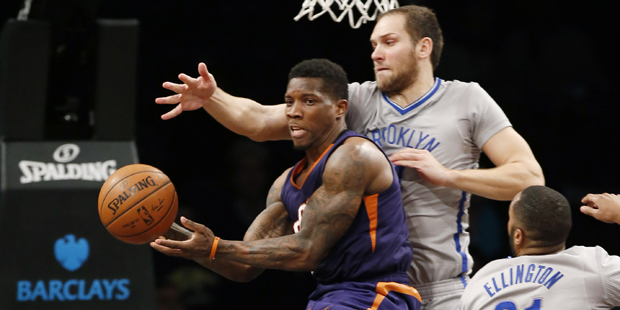 Brooklyn Nets guard Bojan Bogdanovic defends Phoenix Suns guard Eric Bledsoe, left, in the second h...