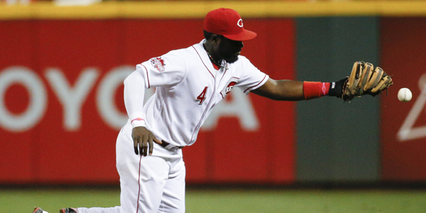 Cincinnati Reds second baseman Brandon Phillips misses a single hit by Pittsburgh Pirates' Neil Wal...