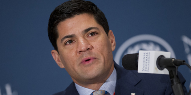 College Football Hall of Fame inductee Tedy Bruschi, a linebacker from Arizona, speaks during the 5...