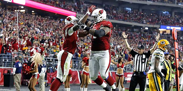 Arizona Cardinals running back David Johnson (31) celebrates his touchdown with teammate Mike Iupat...