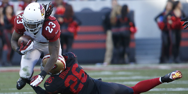 San Francisco 49ers cornerback Tramaine Brock (26) tackles Arizona Cardinals running back Chris Joh...