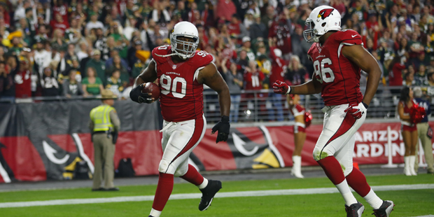 Arizona Cardinals defensive end Cory Redding (90) celebrates his touchdown against the Green Bay Pa...