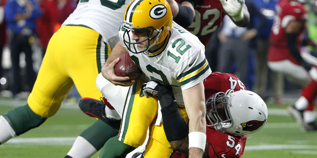 Green Bay Packers quarterback Aaron Rodgers (12) is sacked by Arizona Cardinals inside linebacker D...