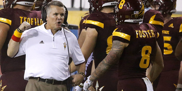 FILE - In this Sept. 26, 2015 file photo, Arizona State head coach Todd Graham, left, talks with D....