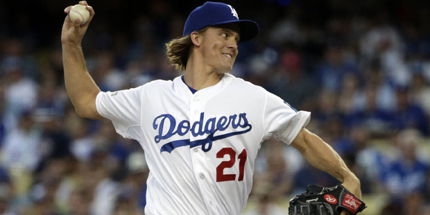 Los Angeles Dodgers starting pitcher Zack Greinke throws to the New York Mets during the first inni...