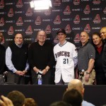 Arizona Diamondbacks General Manager Dave Stewart, from left to right, President and CEO Derrick Hall, owner Ken Kendrick, pitcher Zack Greinke, manager Chip Hale, Chief Baseball Officer Tony La Russa, and Senior Vice-President Baseball Operations De Jon Watson pose for an image after a press conference, Friday, Dec. 11, 2015, in Phoenix. (AP Photo/Rick Scuteri)