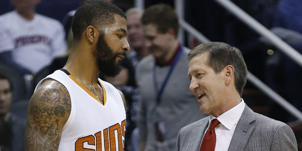 Phoenix Suns head coach Jeff Hornacek, right, talks with Markieff Morris, left, during the first ha...
