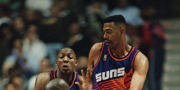 Los Angeles Clippers? Malik Sealy drives the ball past Phoenix Suns? Wesley Person, left, and John ...