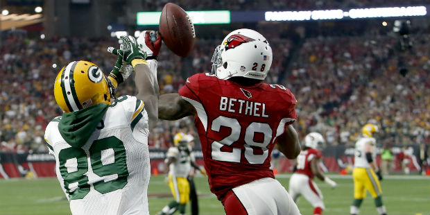 Arizona Cardinals cornerback Justin Bethel (28) intercepts a pass intended for Green Bay Packers wi...