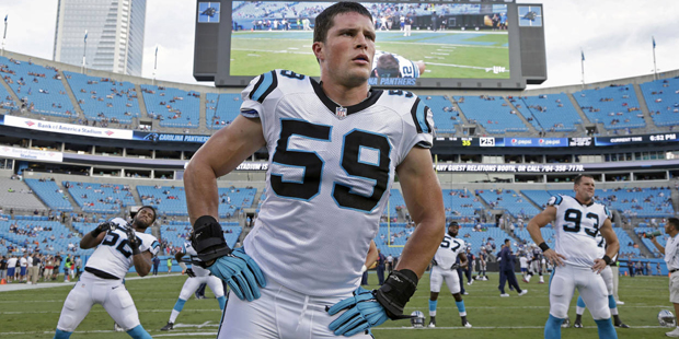 In this photo taken Aug. 28, 2015,  Carolina Panthers' Luke Kuechly (59) stretches before a preseas...