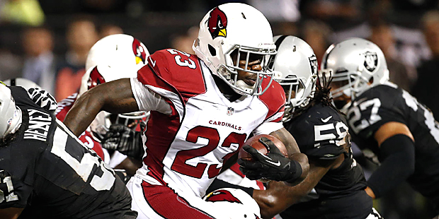 Arizona Cardinals running back Marion Grice (23) evades tackles for an 11-yard touchdown against th...