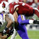 Minnesota Vikings wide receiver Jarius Wright (17) is tackled by Arizona Cardinals free safety Tyrann Mathieu (32) during the first half of an NFL football game, Thursday, Dec. 10, 2015, in Glendale, Ariz. (AP Photo/Ross D. Franklin)