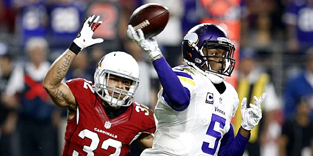 Minnesota Vikings quarterback Teddy Bridgewater (5) throws under pressure from Arizona Cardinals fr...
