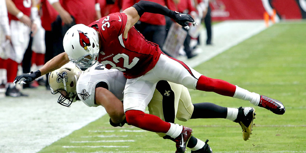 New Orleans Saints fullback Austin Johnson (35) is knocked out of bounds by Arizona Cardinals free ...
