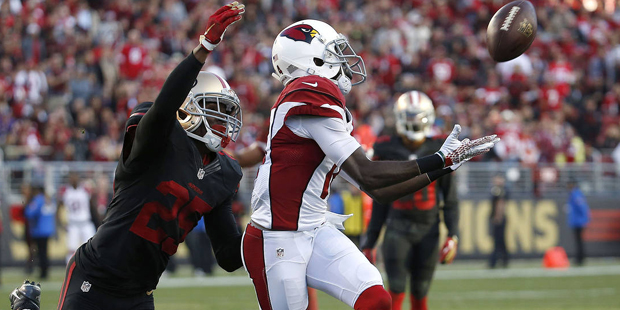 Arizona Cardinals wide receiver J.J. Nelson, right, catches a pass in front of San Francisco 49ers ...