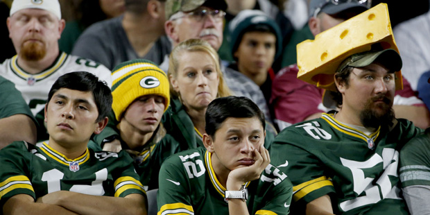 Green Bay Packers fans watch during the second half of an NFL football game against the Arizona Car...