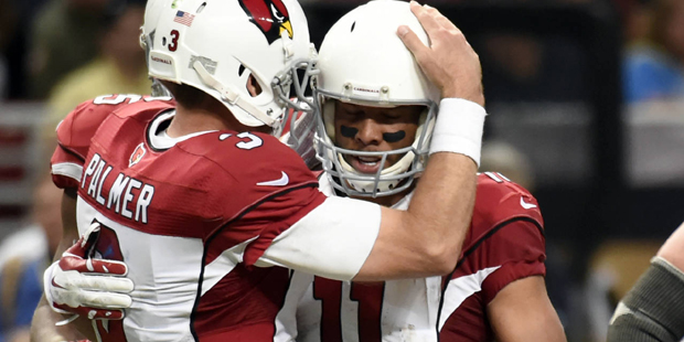 Arizona Cardinals wide receiver Larry Fitzgerald, right, is congratulated by quarterback Carson Pal...