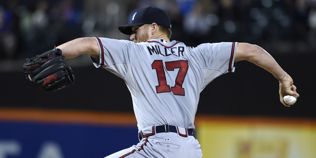 Atlanta Braves starter Shelby Miller pitches against the New York Mets in the first inning of a  ba...