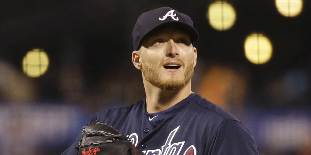 Atlanta Braves starting pitcher Shelby Miller stands on the mound after giving a up a home run to S...