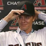 Arizona Diamondbacks pitcher Zack Greinke talks to the media during a press conference, Friday, Dec. 11, 2015, in Phoenix. Greinke could have stayed with the Los Angeles Dodgers or gone up the coast to the San Francisco Giants. Instead, he signed a massive contract with the Arizona Diamondbacks, dramatically shifting the landscape in the NL West.   (AP Photo/Rick Scuteri)
