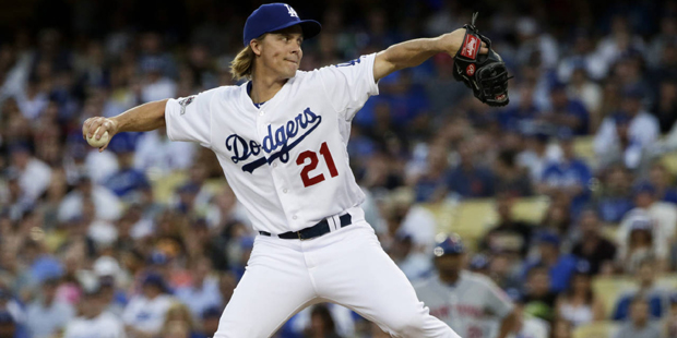 FILE - In this Oct. 10, 2015, file photo, Los Angeles Dodgers starting pitcher Zack Greinke throws ...