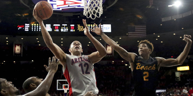 Arizona forward Ryan Anderson (12) works his way under the basket against the Long Beach State defe...