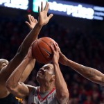 Arizona forward Ryan Anderson (12) wrestles his way to the basket against Long Beach State forward Roschon Prince during the first half of an NCAA college basketball game Tuesday, Dec. 22, 2015, in Tucson, Aria. (Kelly Presnell/Arizona Daily Star via AP)