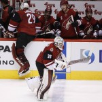 Arizona Coyotes' Louis Domingue (35) replaces Anders Lindback (29), of Sweden, during the second period of an NHL hockey game against the Columbus Blue Jackets, Thursday, Dec. 17, 2015, in Glendale, Ariz. (AP Photo/Ross D. Franklin)