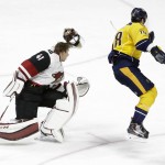 Nashville Predators left wing James Neal (18) jumps past Arizona Coyotes goalie Mike Smith (41) on a breakaway in the third period of an NHL hockey game Tuesday, Dec. 1, 2015, in Nashville, Tenn. (AP Photo/Mark Humphrey)