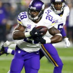 Minnesota Vikings running back Adrian Peterson (28) runs after the hand off from quarterback Teddy Bridgewater (5) during the first half of an NFL football game against the Arizona Cardinals, Thursday, Dec. 10, 2015, in Glendale, Ariz. (AP Photo/Rick Scuteri)