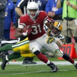 Arizona Cardinals running back David Johnson (31) runs after the catch as Green Bay Packers outside linebacker Jake Ryan (47) defends during the first half of an NFL football game, Sunday, Dec. 27, 2015, in Glendale, Ariz. (AP Photo/Rick Scuteri)