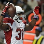 Arizona Cardinals running back David Johnson celebrates after catching a 10-yard pass for a touchdown during the third quarter of an NFL football game against the St. Louis Rams on Sunday, Dec. 6, 2015, in St. Louis. (AP Photo/Jeff Roberson)