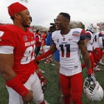 Arizona safety Will Parks, right, talks with New Mexico wide receiver Delane Hart-Johnson at the end of the New Mexico Bowl NCAA college football game in Albuquerque, N.M., Saturday, Dec. 19, 2015. Arizona won 45-37. (AP Photo/Andres Leighton)