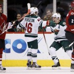 Minnesota Wild's Jared Spurgeon (46) celebrates his goal with Zach Parise (11) as Arizona Coyotes' Nicklas Grossmann (2), of Sweden, and Tobias Rieder (8), of Germany, skate away dejectedly during the second period of an NHL hockey game Friday, Dec. 11, 2015 in Glendale, Ariz. (AP Photo/Ross D. Franklin)
