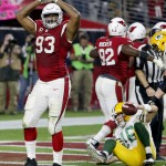 Arizona Cardinals defensive end Calais Campbell (93) signals safety after a sack in the end zone against the Green Bay Packers during the second half of an NFL football game, Sunday, Dec. 27, 2015, in Glendale, Ariz. (AP Photo/Ross D. Franklin)