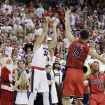 Gonzaga's Kyle Wiltjer (33) shoots against Arizona's Dusan Ristic (14) during the first half of an NCAA college basketball game, Saturday, Dec. 5, 2015, in Spokane, Wash. (AP Photo/Young Kwak)