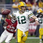 Green Bay Packers quarterback Aaron Rodgers (12) looks to throw against the Arizona Cardinals during the first half of an NFL football game, Sunday, Dec. 27, 2015, in Glendale, Ariz. (AP Photo/Rick Scuteri)