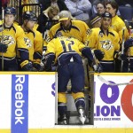 Nashville Predators forward Mike Fisher (12) leaves the ice after being injured in the second period of an NHL hockey game against the Arizona Coyotes, Tuesday, Dec. 1, 2015, in Nashville, Tenn. (AP Photo/Mark Humphrey)