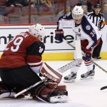 Arizona Coyotes' Anders Lindback (29), of Sweden, makes a save on a shot by Columbus Blue Jackets' Boone Jenner (38) during the first period of an NHL hockey game, Thursday, Dec. 17, 2015, in Glendale, Ariz. (AP Photo/Ross D. Franklin)